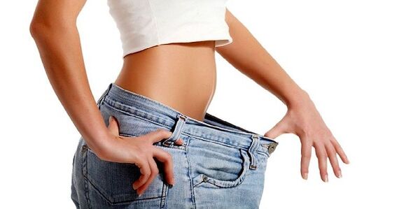 The girl lost weight in her stomach area by eliminating unhealthy foods from her diet. 